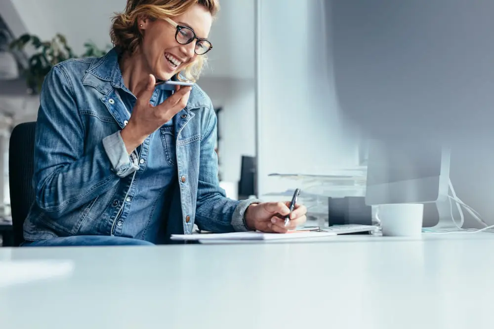 Smiling businesswoman working at her desk.